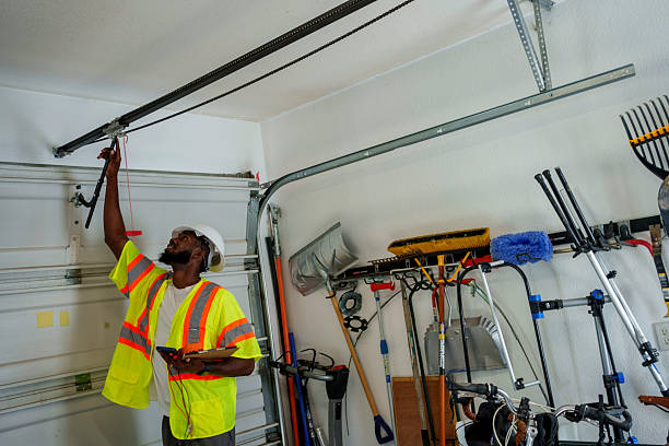 Professional Garage Door Panel Replacement technician working in Des Moines County County, IA
